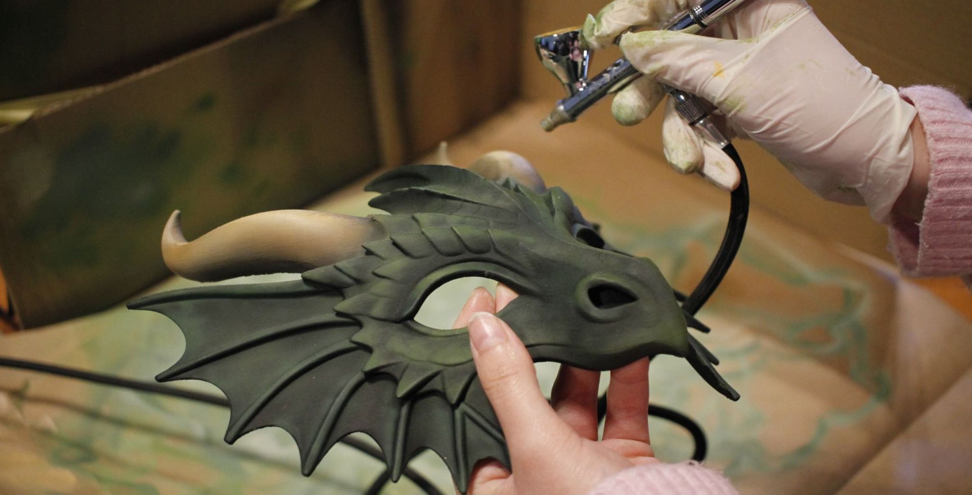 Mònica Aguilá, at the Esplulab workshop in Esplugues, painting one of the 3D printed masks for the characters of the 22nd Legend of Sant Jordi of the Esbart Vila d'Esplugues